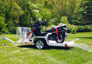 Motorcycle pull-behind trailer and ramp
