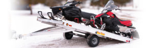 Snowmobile pull-behind flatbed trailers